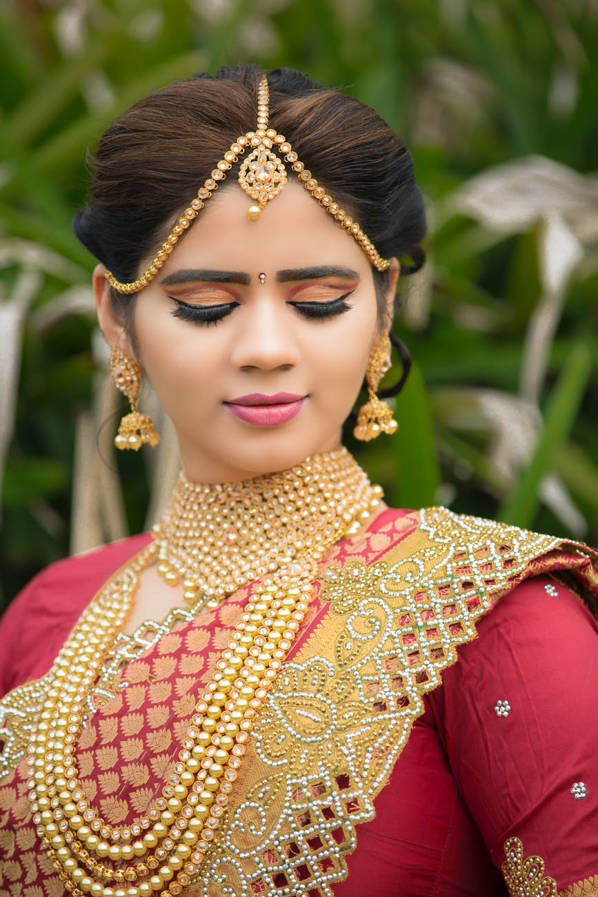 shallow focus photography of woman in red top